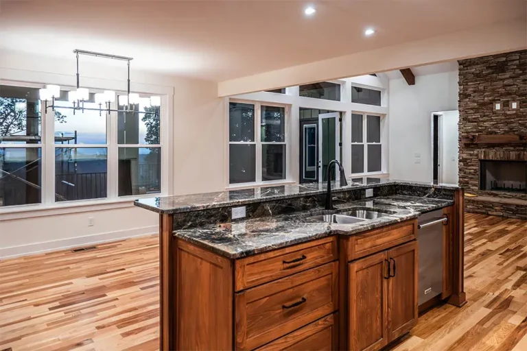Kitchen island with stone fireplace - Cole Construction custom home